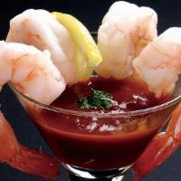 Shrimp Cocktail · 4 bite sized pieces of shrimp, served with cocktail sauce and lemon.