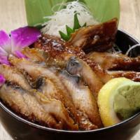 Mini Unagi Don · A classic Japanese dish consists of steamed rice topped with grilled eel fillets that are gl...
