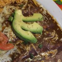 Chicken Mole Enchilada · Served with rice and beans.