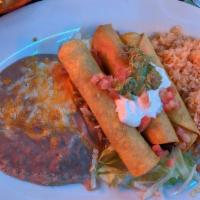#17 Three Beef Taquitos · Deep fried corn tortillas roll stuffed with seasoned meat) served rice and beans guacamole a...