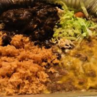 Mole Poblano · A favorite Mexican dish. Tender chicken breast strips served with mole sauce, an ancient Mex...