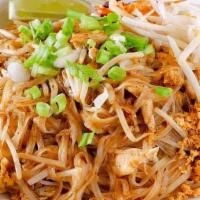 Pad Thai · Fried Thai rice noodles with eggs, tofu, ground peanuts, fresh bean sprouts, and green onions,