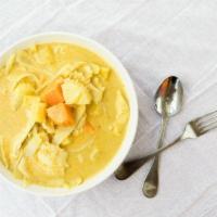 Yellow Curry · Traditional Thai yellow curry simmered in coconut milk with potatoes and green peas and your...