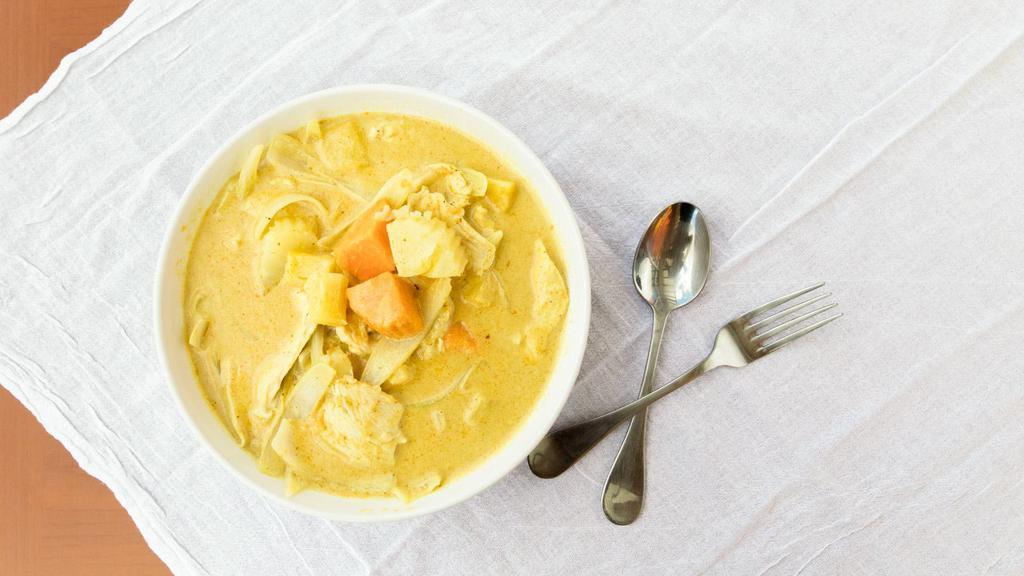 Yellow Curry · Traditional Thai yellow curry simmered in coconut milk with potatoes and green peas and your choice of protein.