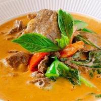 Panang Curry · Spicy curry with coconut milk, sweet basil, and bell peppers.