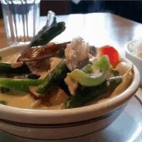 Green Curry · Green curry sauce, eggplants, green beans, bell peppers, and basil with your choice of meat.