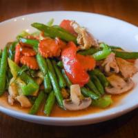 Pad Prik Khing · Sautéed green beans, mushrooms, carrots, . red bell peppers, curry paste, and a touch of coc...