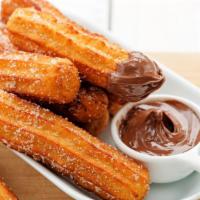 Churro · Traditional sweet dessert of fried dough dusted with sugar.