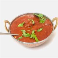 Roganjosh - Goat · Cooked in yogurt with tomatoes and onion gravy based Indian spices and herbs