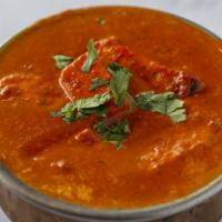 Prawn Tikka Masala · succulent prawns cooked in tomato sauce with a touch of butter.