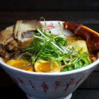 Spicy Ramen · A house favorite rich pork and chicken broth with a house blend of chilis, garlic, ginger, s...