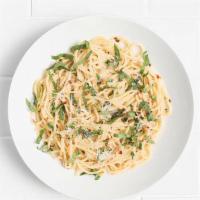 Spaghetti Aglio E Olio · A simple classic with sauteed garlic, olive oil, fresh basil, chilli flakes, and parmesan.