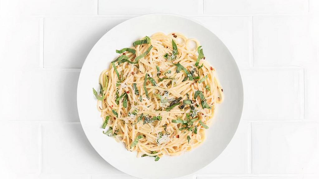 Spaghetti Aglio E Olio · A simple classic with sauteed garlic, olive oil, fresh basil, chilli flakes, and parmesan.