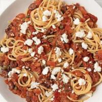 Spaghetti Siciliano · Fresh and sun-dried tomatoes, garlic, Kalamata olives, capers, sherry, feta cheese