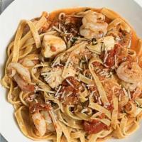Spicy Shrimp Fettuccini · Lightly spicy tomato-butter sauce, fresh mozzarella, parmesan