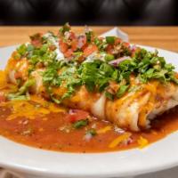 Juan'S Smothered Burrito · Eggs, potatoes, cheddar smothered with green chile, cheddar, lettuce, pico de gallo, and sou...
