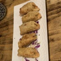 Gyoza (6 Pc) · Homemade pork pan fried gyoza.