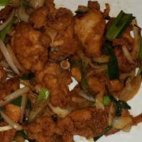 Goma Chicken · Crispy chicken, green onions, white onions and carrots with sesame seed, serve with rice.