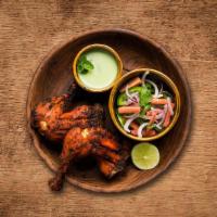 Charred Tandoori Chicken · Bone-in chicken marinated in yogurt and house spices cooked to perfection in an Indian clay ...