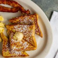 French Toast Special · Four thick wedges of fluffy French toast served with two eggs any style and your choice of b...