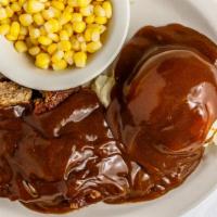 Oven Roasted Meatloaf · Slices of homestyle meatloaf seasoned to perfection and topped with our rich brown gravy.
