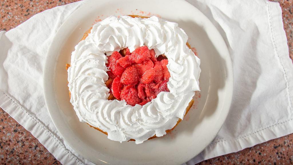 Strawberry Waffle · Topped with strawberries and whipped cream.