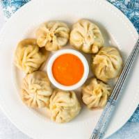 Beef Momo 8Pc (Steamed Or Fried) · Steamed beef dumplings with cabbage, onion, ginger, and homemade spices. (Comes with sauce)