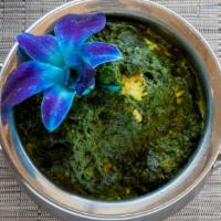 Aloo Saag · Fresh potatoes cooked with spinach and spices.