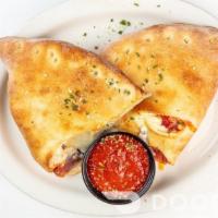 Cheese Calzone · Filled with *Polly-O ricotta, mozzarella, parmesan, marinara sauce served with a side of mar...