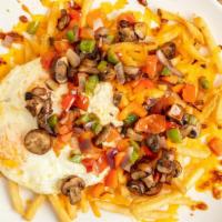 Veggie Skillet · Eggs your way, red onion, red and green bell pepper, mushrooms and tomatoes over French frie...