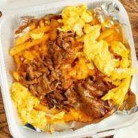Tri-Tip Skillet · Eggs your way, grilled BBQ tri-tip slathered in bbq sauce, chopped onion rings, over French ...