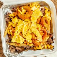 Mac Attack Skillet · Eggs your way, fresh grilled and chopped half-pound Angus beef patty, a generous scoop of ou...