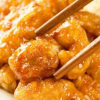 Orange Chicken · Served with Steamed Rice and Side Salad.