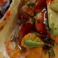 Taco Gobernador · Shrimp, melted cheese, onion, tomato, cilantro, la cruda sauce, chipotle sauce.