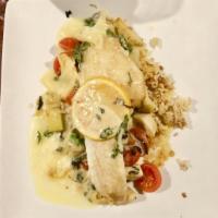 Pan Seared Walleye · Sautéed artichokes and tomatoes in a lemon beurre Blanc sauce. Served with rice pilaf.