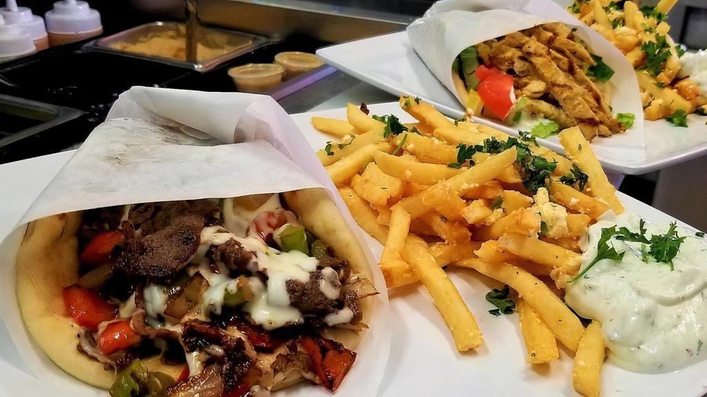 Gyro Pita Combo · With fries or  side of Greek salad and a drink.