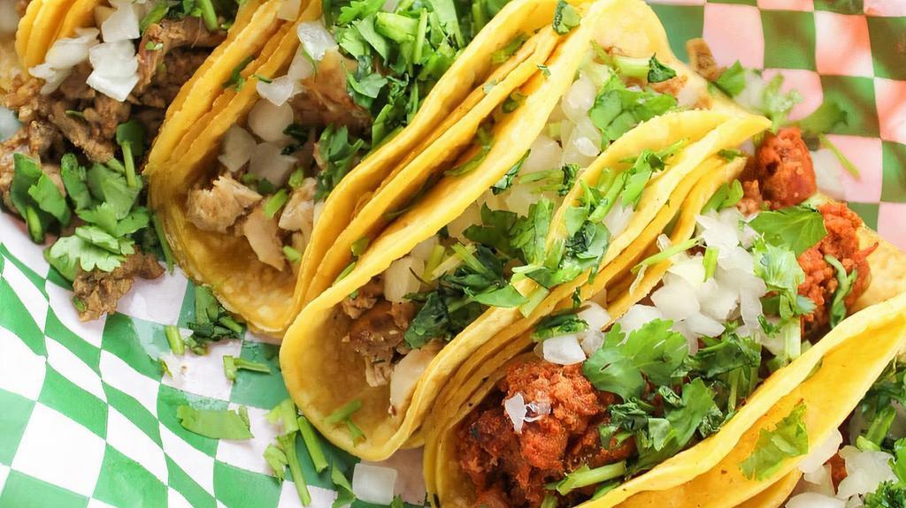 Street Tacos Meal · A Half fried corn tortilla with your choice of meat between Steak, chicken, or pork, topped with onions and cilantro. Meal comes your one side choice (rice, beans, chips or house salad) and a drink.