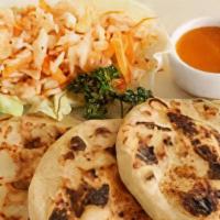 Pork Pupusas Meal · A Salvadoran dish made of a thick corn tortilla and stuffed with a savory filling of chichar...