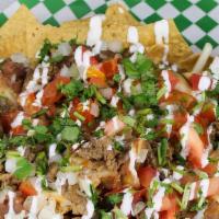Nachos  · Tortilla chips with pinto beans, Jack cheese, your choice of meat, tomatoes, onion, sour cre...