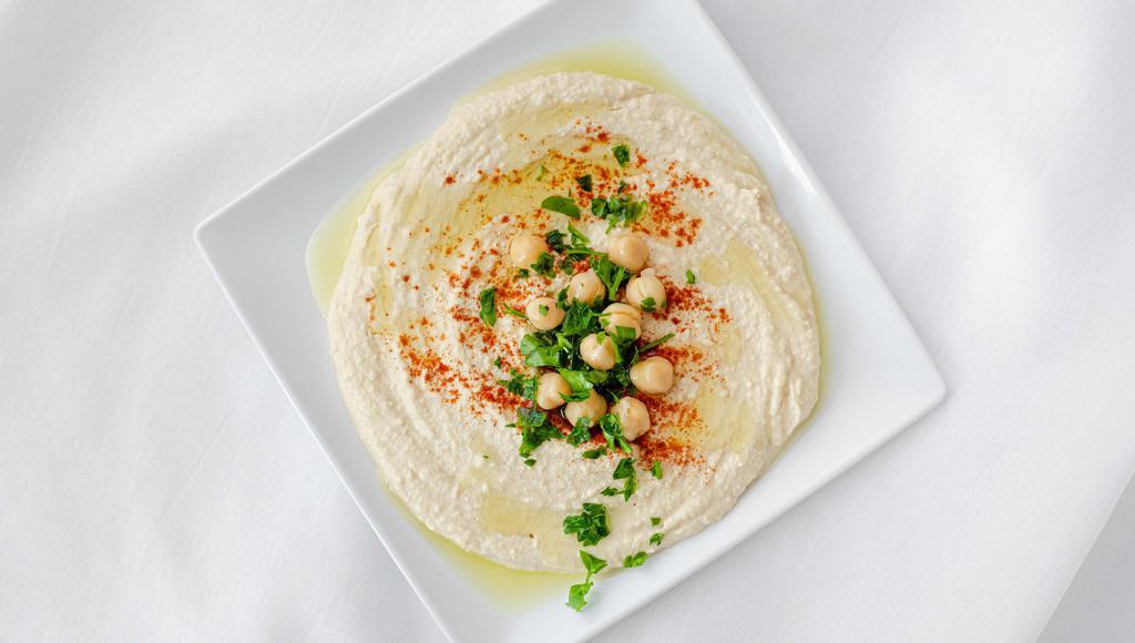 Hummus · A smooth mixture of garbanzo beans, tahini, garlic, oil, and lemon that pairs perfectly with pita bread. VGN GF