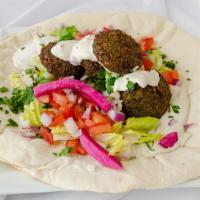 Falafel Wrap · Garbanzo beans, parsley, onion, and spices formed into balls and fried. Made with tahini. Ea...
