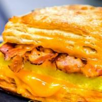 Bacon & Egg Croissant Sandwich · Scrambled eggs, cheddar cheese, and strips of bacon on a fresh buttery croissant bun make fo...