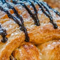 Chocolate Croissant · Premium imported Belgian dark chocolate inside handcrafted all-butter croissant, topped with...