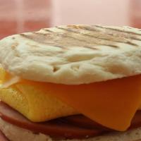 Canadian Bacon Egg Cheddar Cheese English Muffin  · Meat egg cheddar cheese served with breakfast potatoes as side