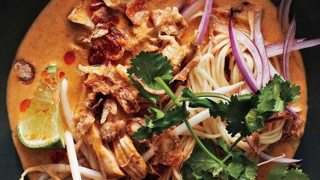 Khao Soi Curry. · <GF : optional> Classic curry over egg noodles from Northern Thailand. Curry made from scratch, choice of protein, bean sprouts, pickled mustard greens, shallots, cilantro. *Chicken option will be our bone in braised chicken*.  *<GF> option will be substituted to rice noodles*