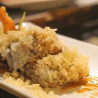 Crunch Roll · In - shrimp tempura, crab, cucumber, avocado. Out - crunch. Sauce - eel.