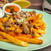 Mexi-Steak Fries · Thick fries topped with carne asada, cilantro-onions, pico de gallo. sour cream and house mo...