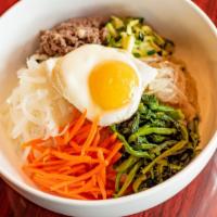 Bibimbap · Choice of vegetables, tofu or beef. Steamed white rice topped with variety assorted vegetabl...