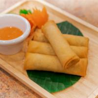 Crispy Spring Rolls · Egg roll wrapped with mixed vegetables and deep-fried and served with plum sauce.