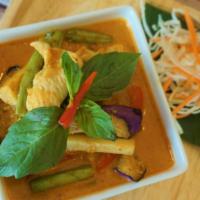 Red Curry · Red curry paste with coconut milk, bamboo shoots, bell peppers and Thai Basil.